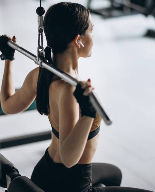 Young attractive woman exercising at the gym